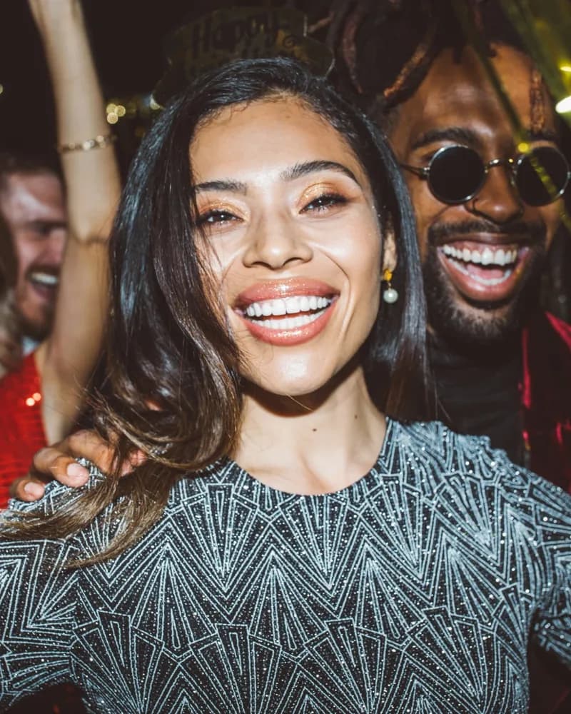 Friends laughing together at a party